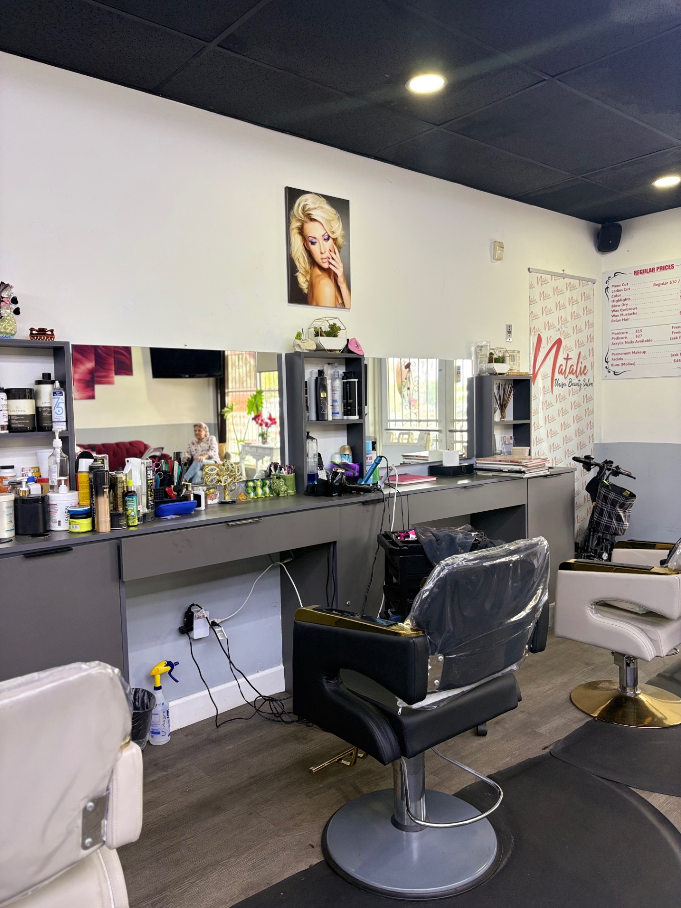 Hair styling stations with mirrors and products